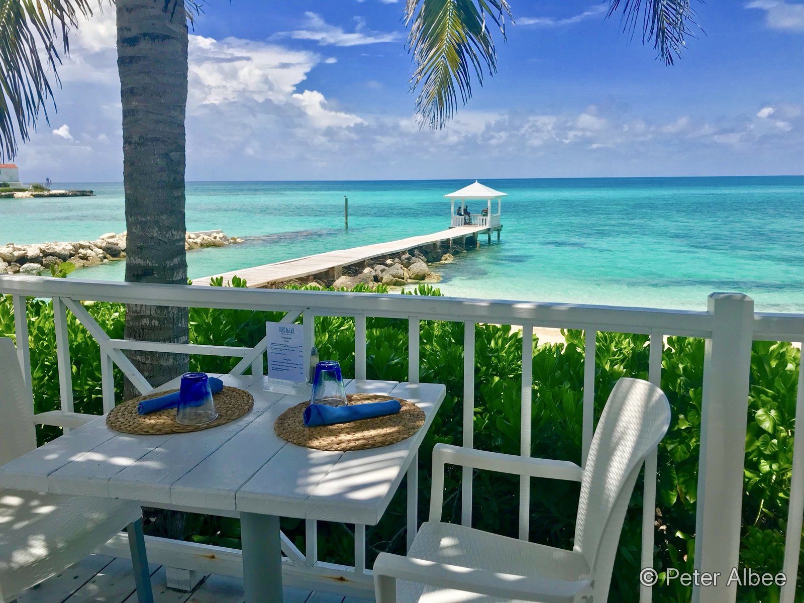 Waterfront resort deck with turquoise water, Turks and Caicos